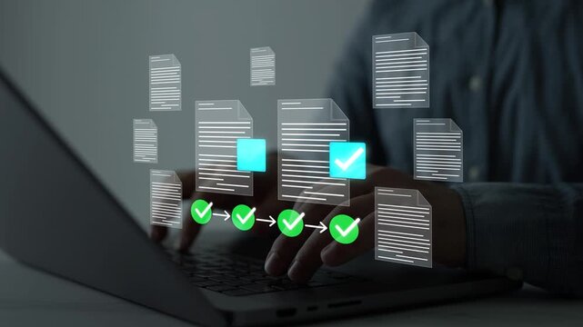 Businessman using a computer to complete a digital checklist and online survey, document management, task tracking, workflow automation, business productivity, data entry and corporate administration.