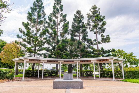 Calliope Anzac Memorial, a war memorial pavilion with plinth surrounded by pine trees