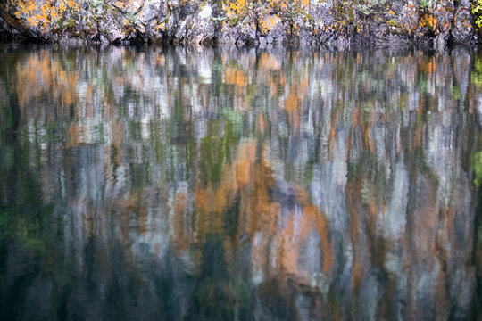 Colorful reflection from rocks in a lake near Soldotna, Alaska on a summer day.