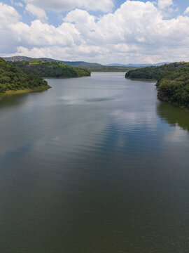 Scenic view of a tranquil lake surrounded by dense forest