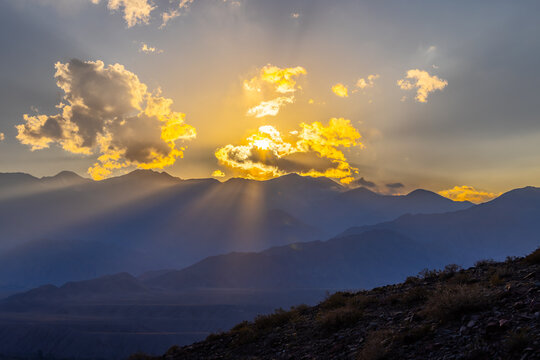 Mountain Range at Sunset with Golden Rays in Kyrgyzstan