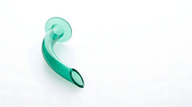 Green translucent nasopharyngeal airway tube on bright white background isolated under soft studio top lights