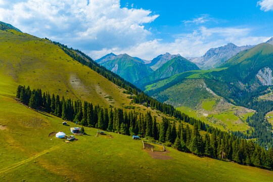Aerial View of Mountain Landscape with Yurt Settlement in Kyrgyzstan