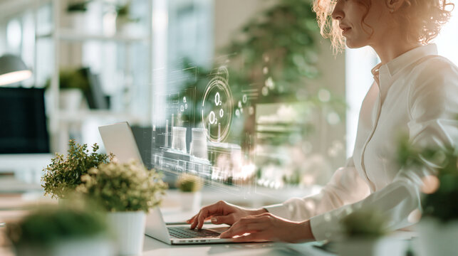 Analyst working on a laptop, over-the-shoulder view
