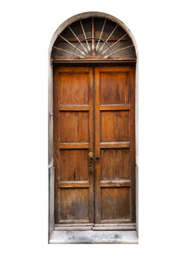 Old double wooden door isolated - Weathered rustic entrance featuring traditional rectangular panels and  semicircular arch window with fan-shaped wrought iron bars.