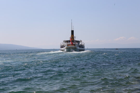 Paddle steamer wake on the blue water of Lake Geneva