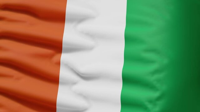 Ivory Coast flag waving in the wind, seamless loop. National flag of Ivory Coast, satin fabric close-up, 4K animation