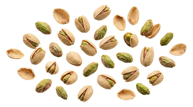 Scattered salted pistachios and empty nutshells arranged neatly in creative composition on transparent background