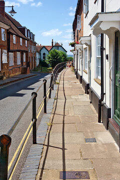 A charming view of the historic Castle Street featuring traditional British architecture, historic brick buildings, and a quiet street scene in the town center of Aylesbury, Buckinghamshire, England.