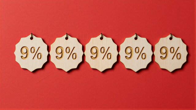 Five wooden 9% discount tags arranged neatly on a vibrant red background.