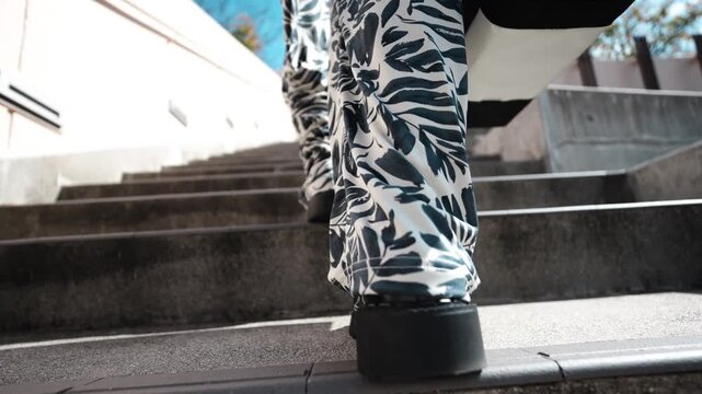 Close-Up of Person Climbing Outdoor Stairs