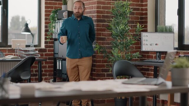 Workplace harassment, boundaries and inappropriate flirting as a woman makes suggestive gestures toward a male coworker near a water dispenser; professional conduct and unwanted attention at work.