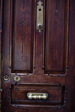Dark, antique wooden door closeup, background texture