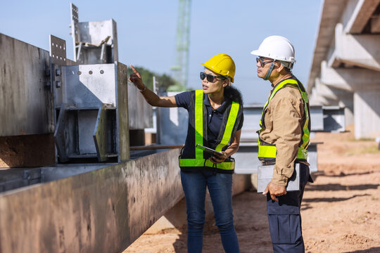 Engineers Inspecting Structural Steel Components for Bridge Construction