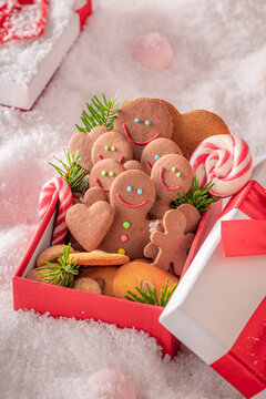 Close Up Red Gift Box of Smiling Gingerbread Cookies
