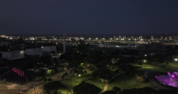 Buenos Aires Argentina Aerial v138 dusk night tracking flyover over Floralis Generica and Plaza de las Naciones Unidas toward Aeroparque and Palermo Chico - Shot with 5k Camera - Jan 24th 2026