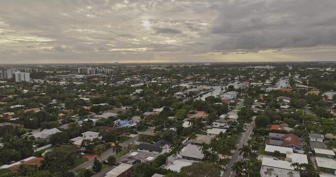 Pompano Beach Florida Aerial v2 flyover above residential neighborhoods and canal waterways toward the Intracoastal cityscape - Shot with 5k Camera - Dec 10th 2023