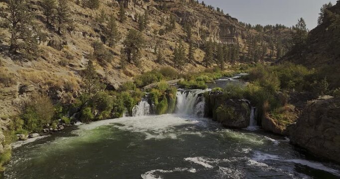 Steelhead Falls Deschutes River Oregon Aerial v107 low tracking flyover past the waterfall and upstream rapids through the rocky river canyon - Shot with 5k Camera - Aug 26th 2023