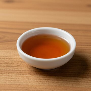 Rich Vanilla Extract in Small Bowl