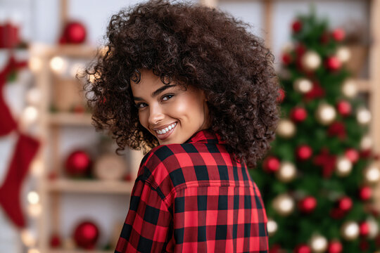 Afro american girl smiling wearing flannel shirt, christmas accessory background