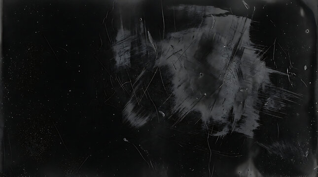 Abstract dark graphite texture with scratched surface and distressed grunge overlay effect.
