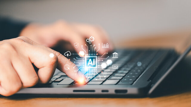 Close up finger of professional using laptop with AI agent technology. Concept of artificial intelligence, digital innovation, machine learning and futuristic business technology
