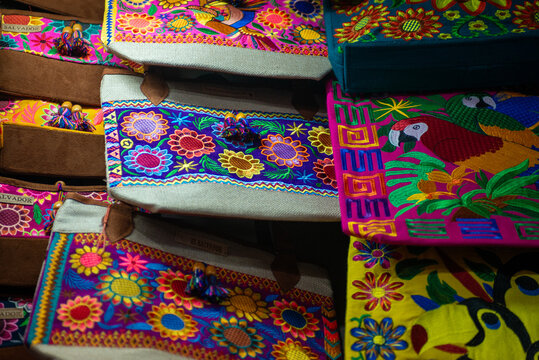 Colorful Embroidered Bags with Floral and Parrot Designs in El Salvador