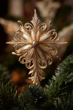 Christmas Star with sculptural baroque leaves and radiant golden surface creating ornate focal point on festive tree display