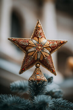 Christmas Star featuring red and gold embroidery with beads and pearls, designed as ornate topper on snowy pine tree