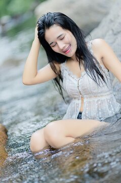 Young Woman Enjoying Refreshing Swim at Wang Takrai Waterfall