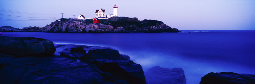 Nubble lighthouse on rocky coast at cape neddick