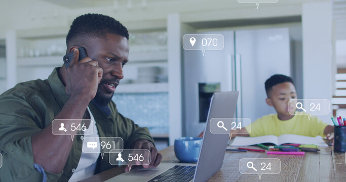 Image of icon and numbers over stressed african american father working from home