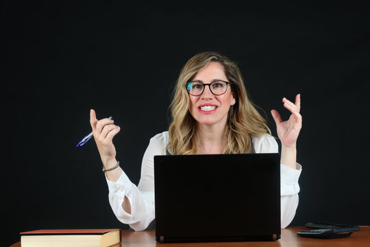 Professional Blonde Businesswoman Working with Laptop Computer at Office Desk