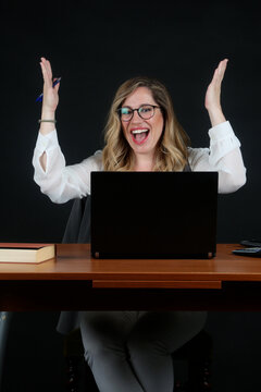 Professional Blonde Businesswoman Working with Laptop Computer at Office Desk