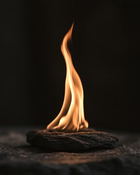 Eternal flame flickering on stone surface, minimal memorial concept for remembrance and tribute