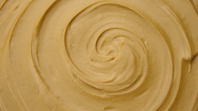 Creamy peanut butter top view.
Peanut butter is a delicious and nutritious food that offers several health benefits.