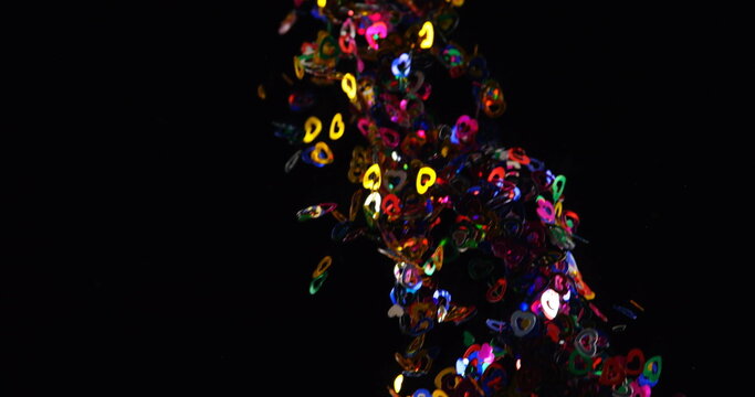 Close-up of confetti falling from the top