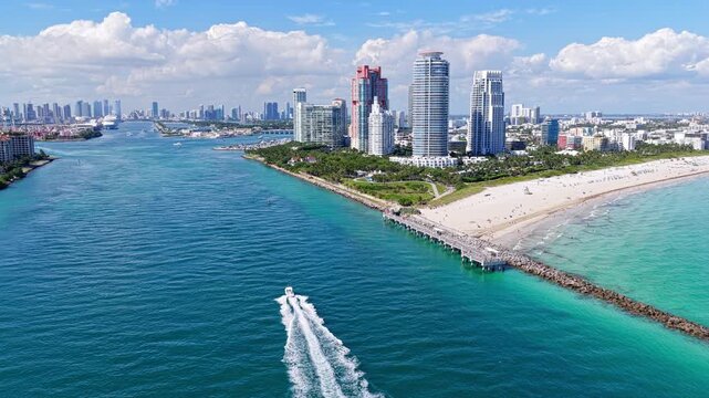 Boating lifestyle. Aerial view on luxury charter yacht. Landscape aerial with Miami skyscraper. Luxury skyscraper in Miami south beach. Motorboat at sea. Landscape of Miami south beach. Yacht at sea