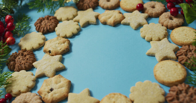 Christmas decorations with cookies and copy space on blue background