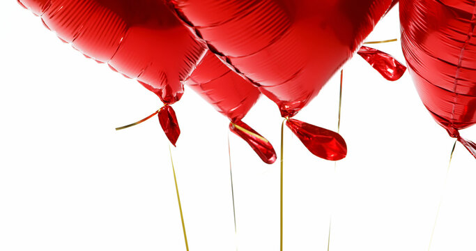 Red balloons floating in the air