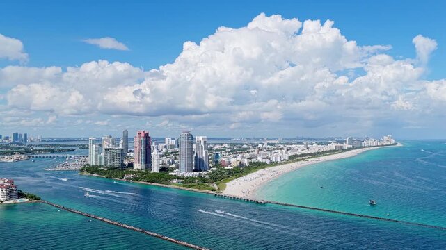 Luxury skyscraper in Miami south beach. Motorboat at sea. Landscape of Miami south beach. Yacht at sea. Aerial view on luxury charter yacht. Landscape aerial with Miami skyscraper. Urban coastline