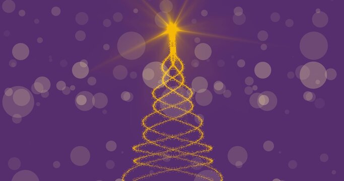 Golden spiral Christmas tree glowing beneath star while bokeh circles floating on purple backdrop
