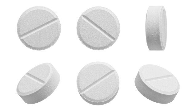 White round pharmaceutical pills with a score line in various angles