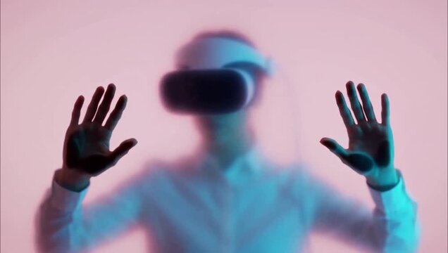 Person wearing virtual reality headset interacting with digital interface in colorful studio lighting.