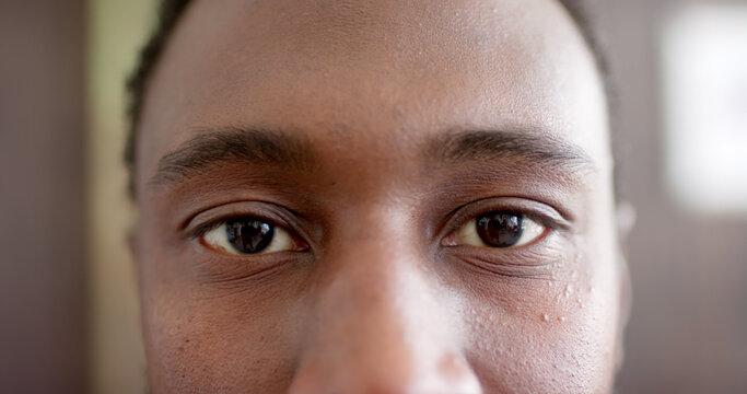 Close up portrait of african american businessman looking at camera at office
