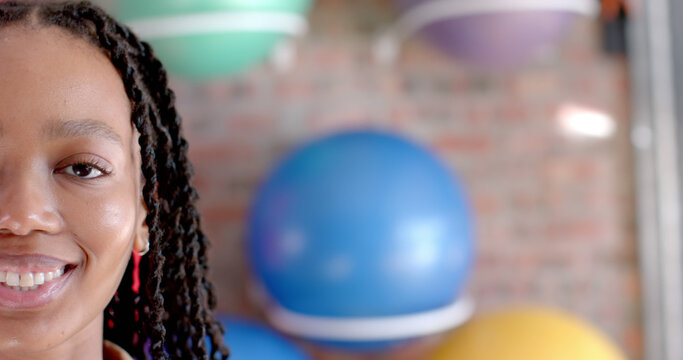 Half portrait of happy african american casual businesswoman with copy space