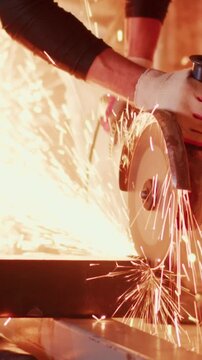 Crafting Metal: A Metalworker Uses a Cutting Tool to Shape Steel, Showcasing Skill and Precision in the Art of Metalworking and Fabrication