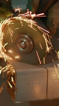 Close-Up Shots of Metal Grinding Process with Sparks Emitting from the Disc, Capturing the Intensity and Motion of Metalworking Techniques in Action