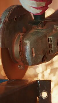 Close-Up of Metal Grinding Process Featuring a Spark-Generating Tool in Action, Showcase of Industrial Working Conditions with Focus on Safety and Technique