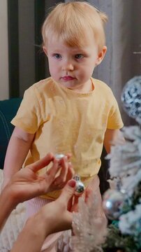 A Curious Child Engaging in Playful Activity in a Cozy Indoor Setting with Soft Textures and Gentle Lighting, Embracing Moments of Innocent Exploration